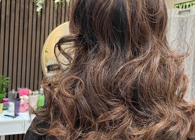 Elegant wavy hairstyle at Shriji Beauty Touch, Huddersfield, England, GB, featuring expert styling.
