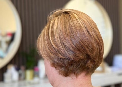 Stylish bob haircut at Shriji Beauty Touch in Huddersfield, England, GB. Perfectly styled layers showcasing salon expertise.