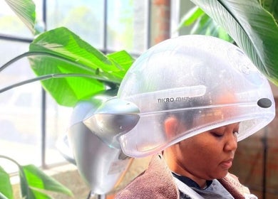 Relaxing hair treatment at Shriji Beauty touch in Huddersfield, England, GB under a steam hood.