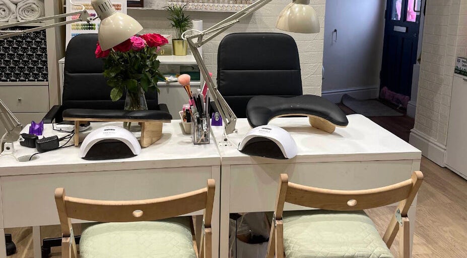 Sophisticated nail station at Shriji Beauty Touch, Huddersfield, England, GB, featuring modern decor.