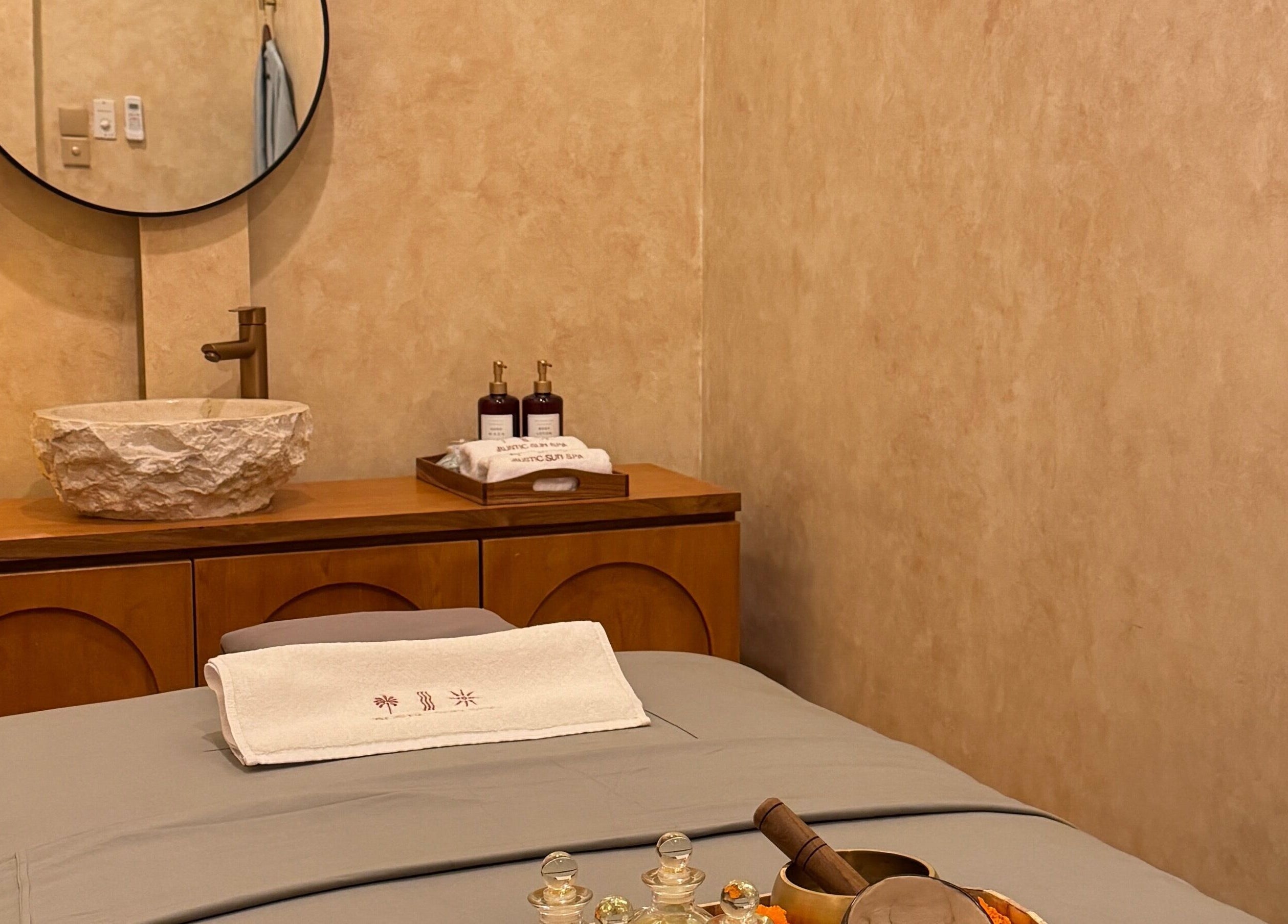 Relaxing spa room at The Rustic Sun Spa - Berawa with cozy decor and massage table, Bali, Bali, ID.