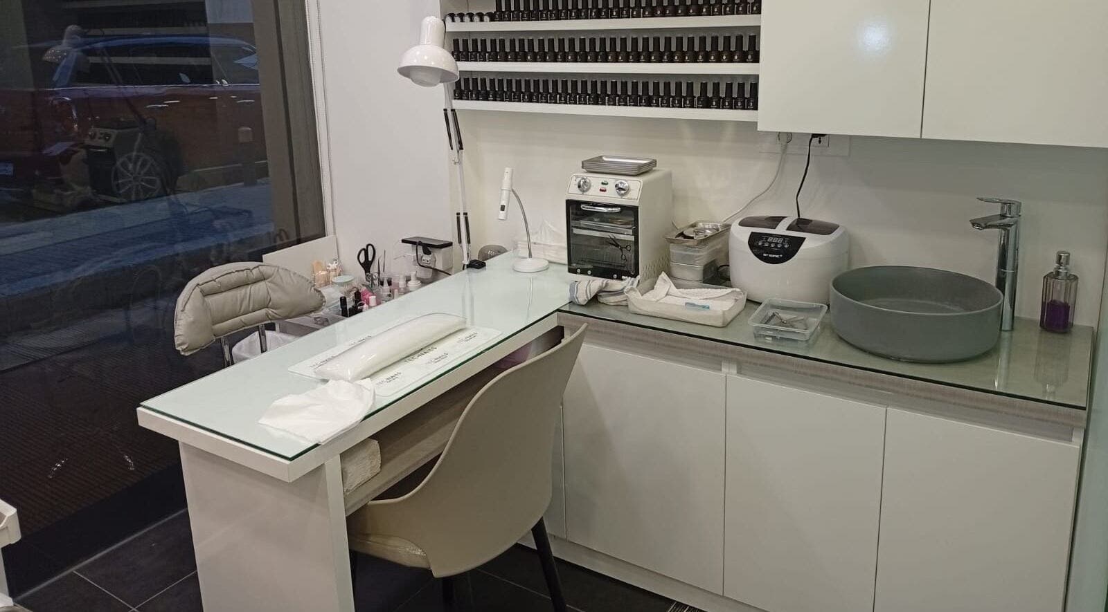 Modern nail station at Polish Nail & Beauty Lounge in Bayrut, Beirut Governorate, LB, showcasing sleek design.