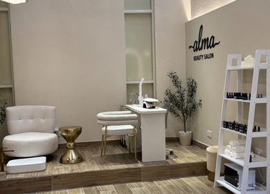 Chic nail service area at Alma Beauty Salon, Lusail, Al Daayen Municipality, QA with modern decor and seating.