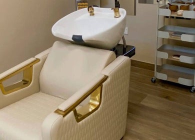 Luxurious hair wash station at Alma Beauty Salon, Lusail, Al Daayen Municipality, QA, featuring elegant white seating.