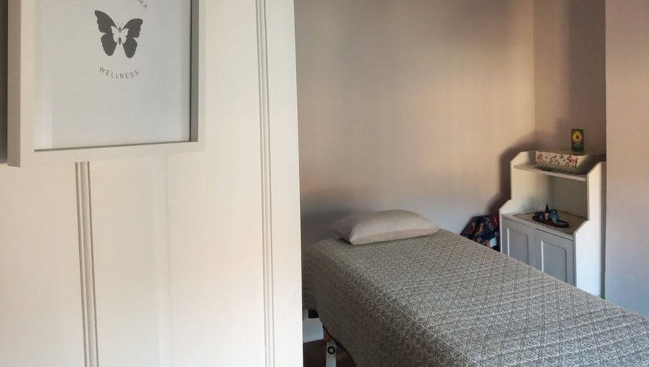 Relaxing massage room at Little Mamma Wellness, Bowburn, England featuring serene decor and treatment bed.