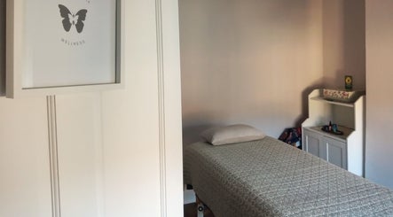 Relaxing massage room at Little Mamma Wellness, Bowburn, England featuring serene decor and treatment bed.