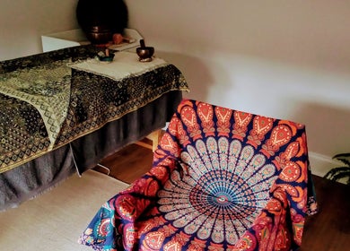 Relaxation room at Little Mamma Wellness, Bowburn, England, GB featuring a decorative chair and treatment table.