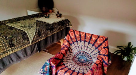 Relaxation room at Little Mamma Wellness, Bowburn, England, GB featuring a decorative chair and treatment table.