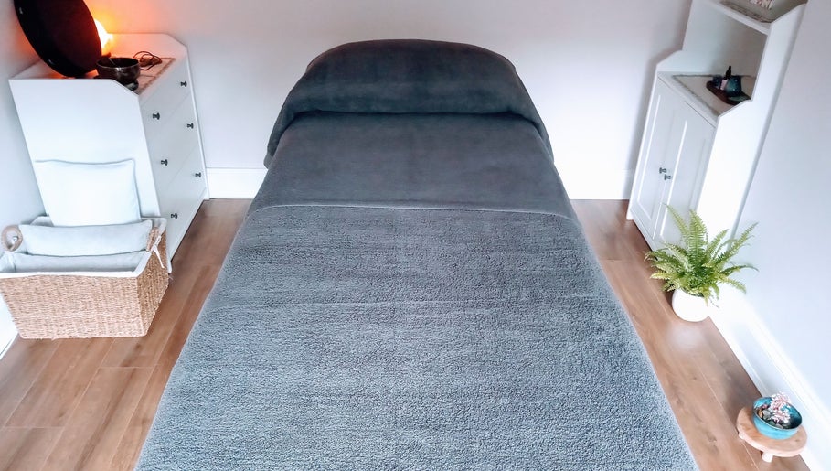 Calming massage room at Little Mamma Wellness, Bowburn, England, GB with a plush treatment bed.