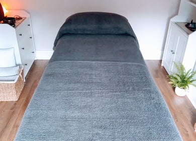 Calming massage room at Little Mamma Wellness, Bowburn, England, GB with a plush treatment bed.