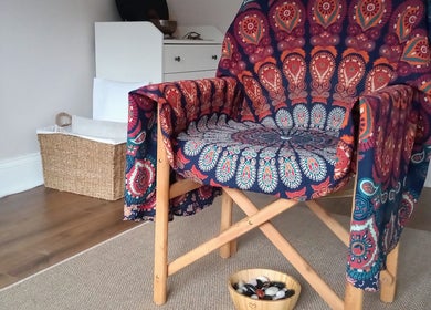 Relaxing chair with vibrant fabric at Little Mamma Wellness, Bowburn, England, GB, offering peaceful ambiance.
