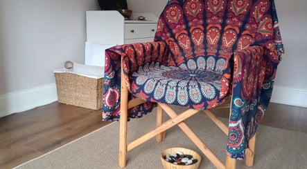 Relaxing chair with vibrant fabric at Little Mamma Wellness, Bowburn, England, GB, offering peaceful ambiance.