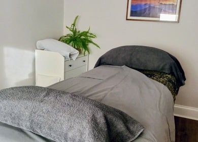 Cozy massage bed in Little Mamma Wellness, Bowburn, England, GB with a serene and inviting atmosphere.