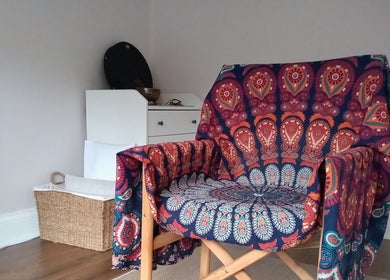 Colorful chair in serene room at Little Mamma Wellness, Bowburn, England, GB. Perfect for relaxation and comfort.