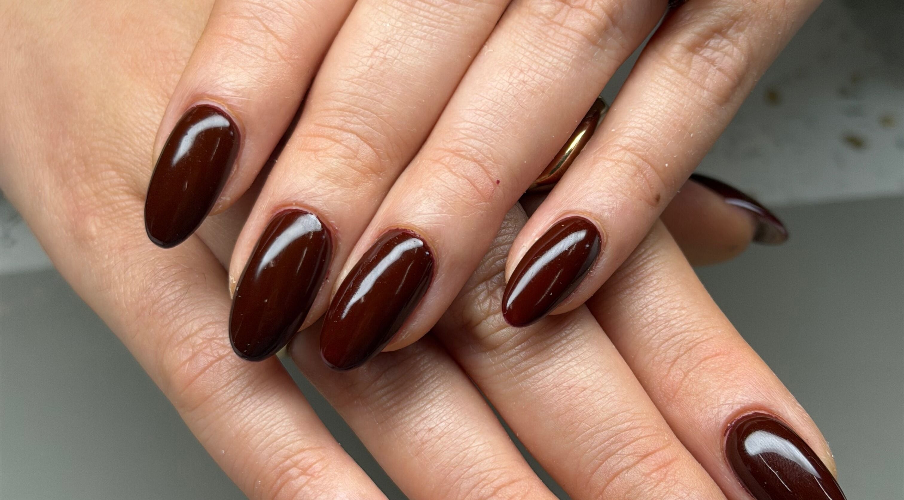 Rich mahogany nails at Aura オーラ Nails & Spa, Yokosuka, Kanagawa, JP. Ideal for chic, polished looks.