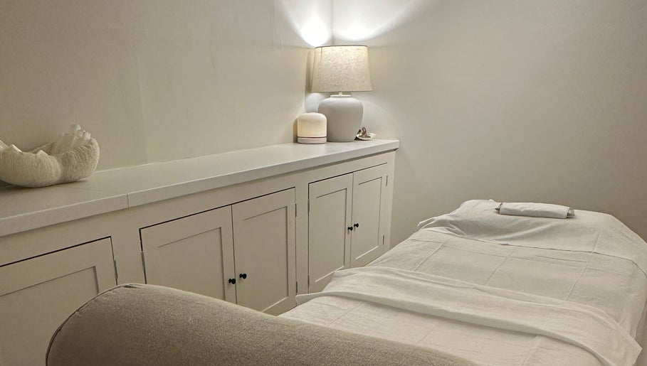Relaxing spa room at Beauty by Ella, Derby, England, GB, with a cozy massage bed and ambient lighting.