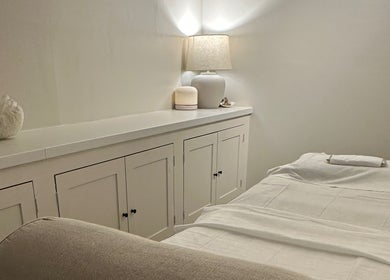 Relaxing spa room at Beauty by Ella, Derby, England, GB, with a cozy massage bed and ambient lighting.