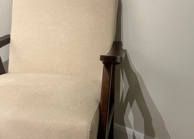 Comfortable beige chair at Beauty by Ella, Derby, England, GB, offering a serene setting for relaxation.