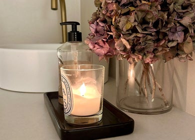 Candlelit ambiance with flowers at Beauty by Ella in Derby, England, GB enhances relaxation.