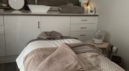 Relaxing treatment room at The Little Beauty Salon, Grimsby, England, GB with cozy towels and soft lighting.