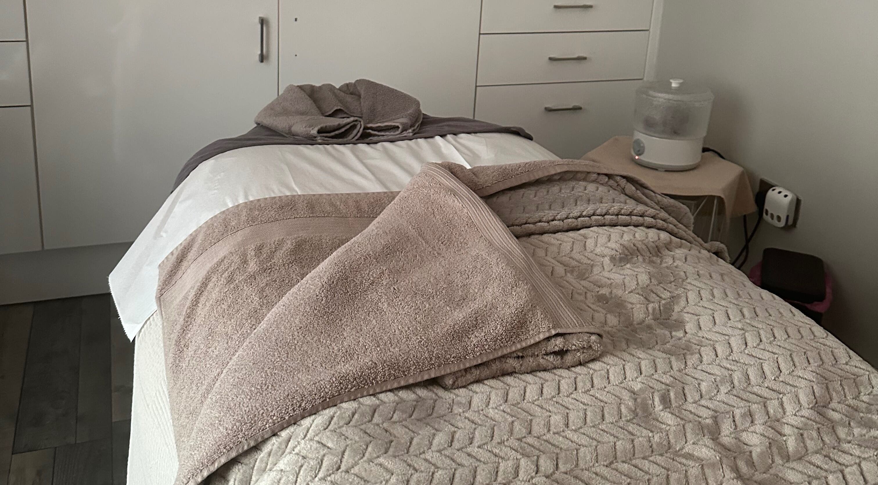 Peaceful treatment room at The Little Beauty Salon in Grimsby, England, GB, featuring a cozy massage bed.