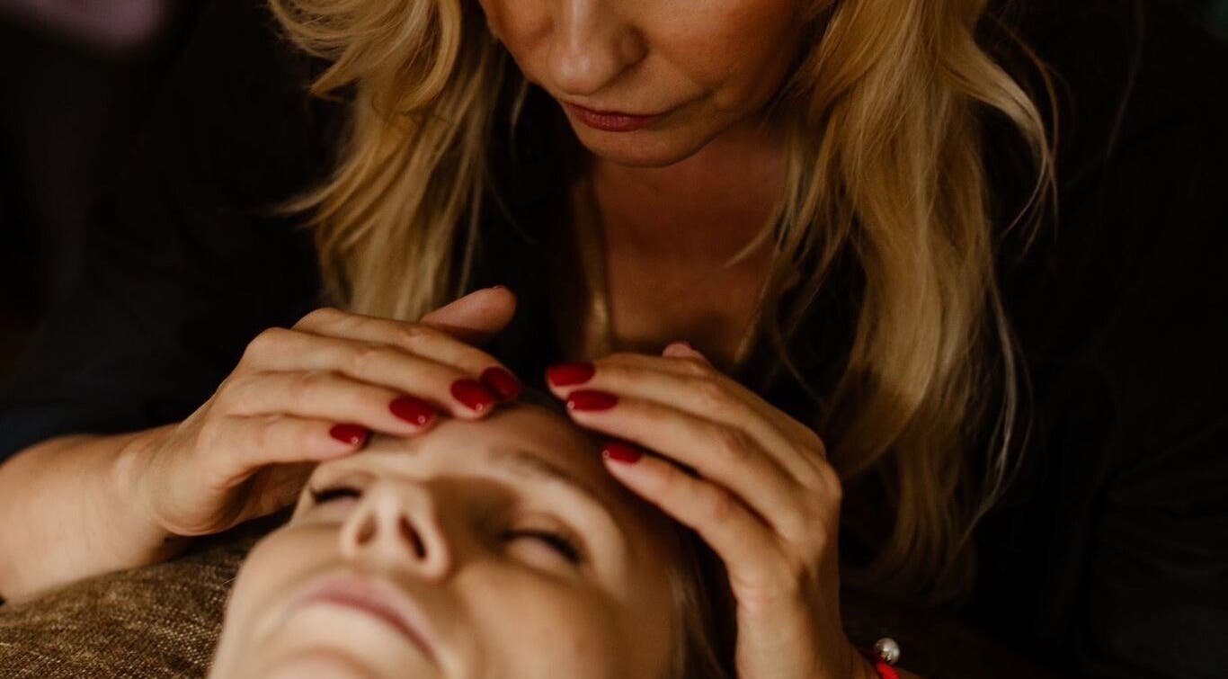 Relaxing therapy session at Energoterapija in Rīga, LV with gentle facial massage.