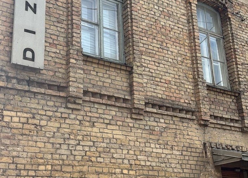Historic brick facade of Energoterapija venue in Rīga, LV showcasing classic architecture and design.