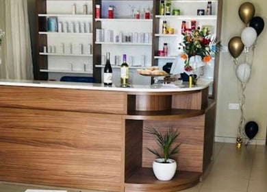 Reception at Aesthetics by Lourdes Zammit Calleja, Is-siġġiewi, MT with flowers, wine, and decor.