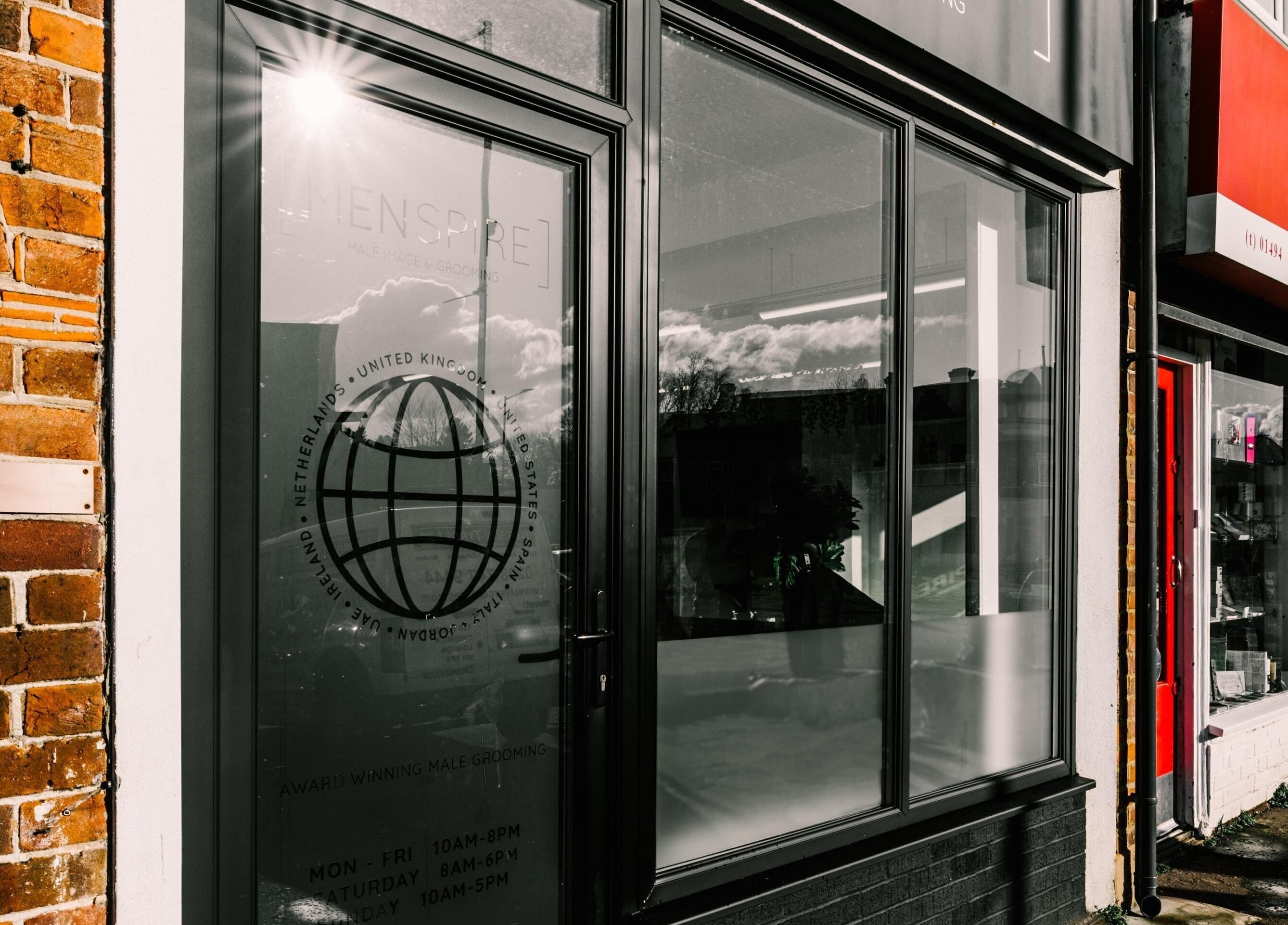 Front view of Menspire Beaconsfield salon exterior, Beaconsfield, England, GB, showcasing a stylish entrance.