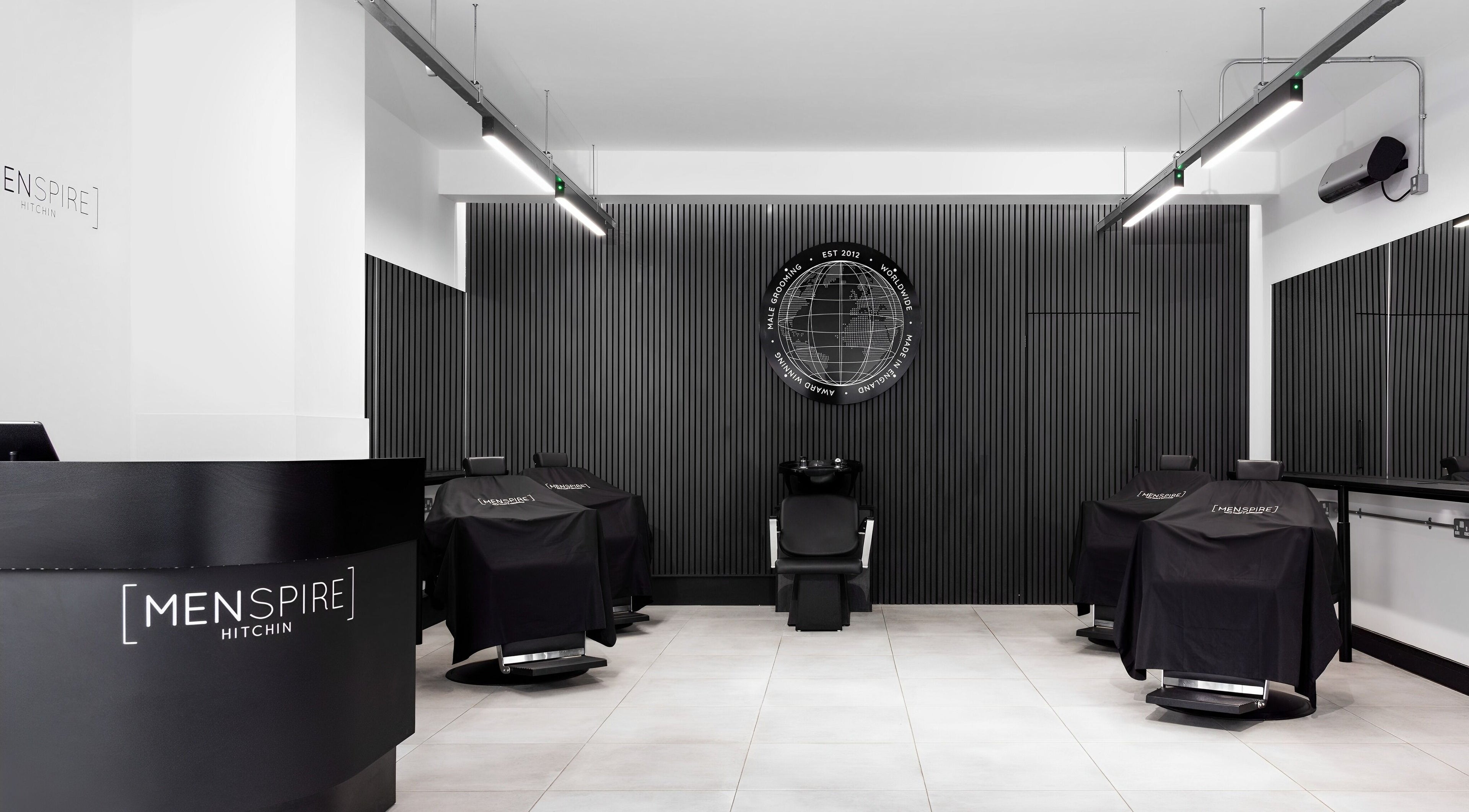 Interior of Menspire Hitchin barbershop with sleek, modern design in Hitchin, England, GB.