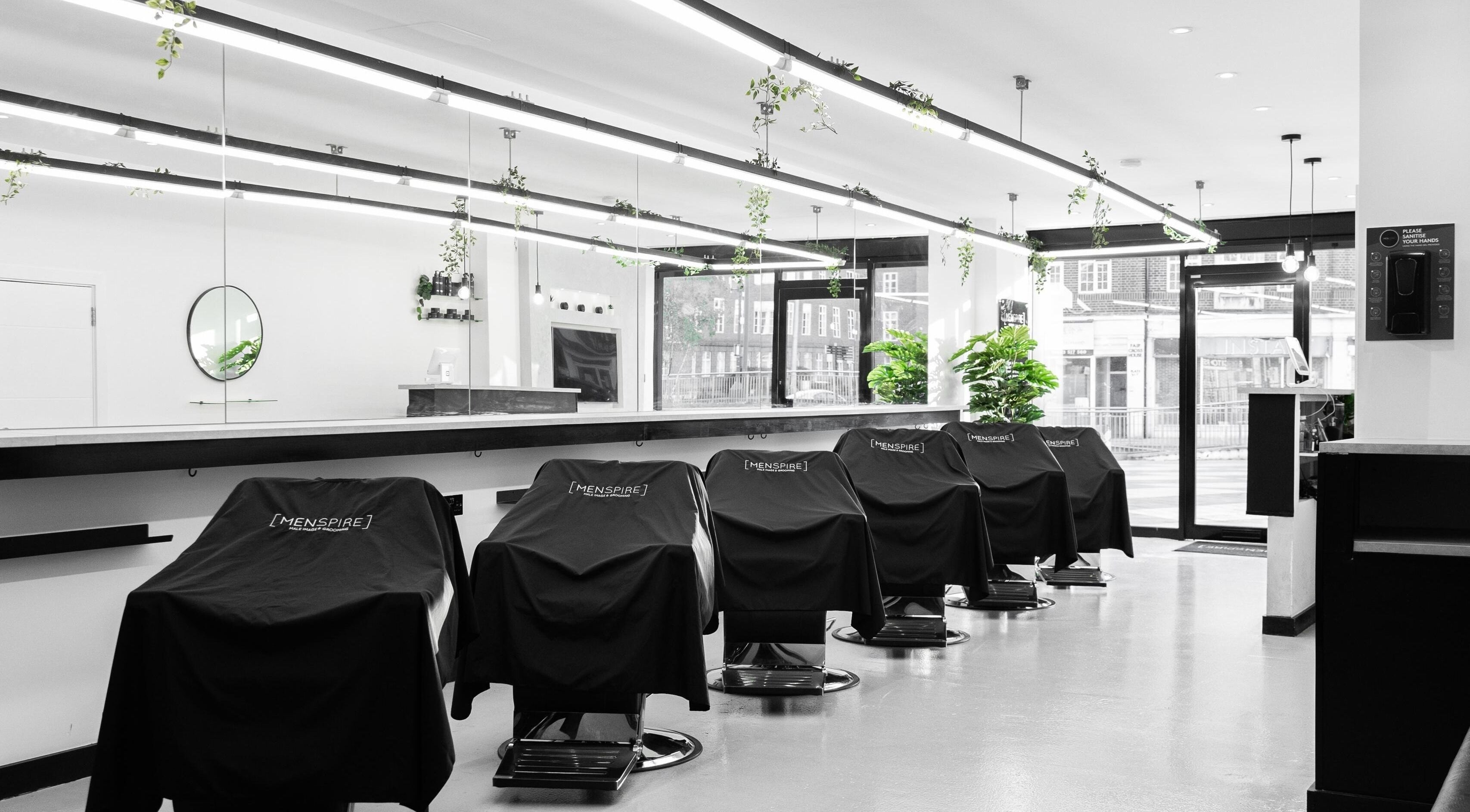 Menspire Watford interior featuring sleek barber chairs in Watford, England, GB.