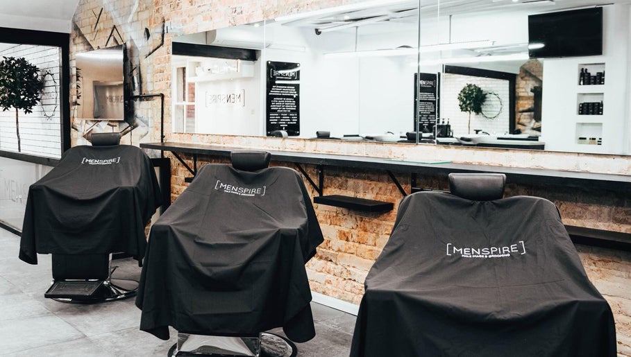 Elegant Men’s grooming chairs at Menspire St Albans, St Albans, England, GB with modern decor.
