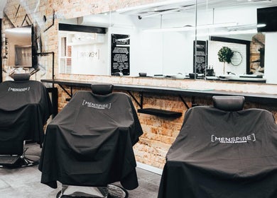 Elegant Men’s grooming chairs at Menspire St Albans, St Albans, England, GB with modern decor.