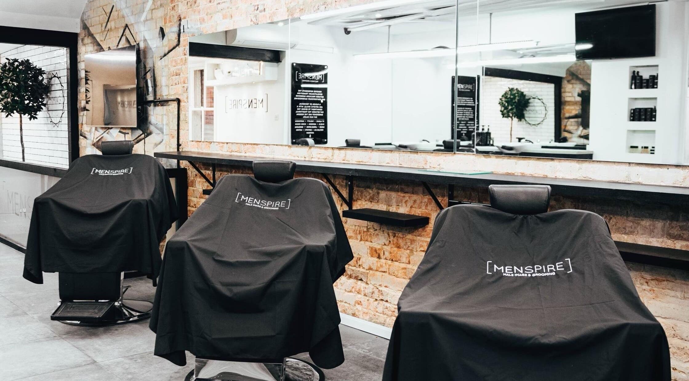 Elegant Men’s grooming chairs at Menspire St Albans, St Albans, England, GB with modern decor.