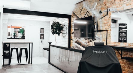 Modern interior of Menspire St Albans salon in St Albans, England with stylish decor and grooming chair.