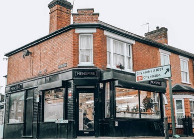 Exterior of Menspire St Albans in St Albans, England, GB showcasing stylish black signage.