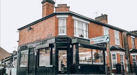 Exterior of Menspire St Albans in St Albans, England, GB showcasing stylish black signage.