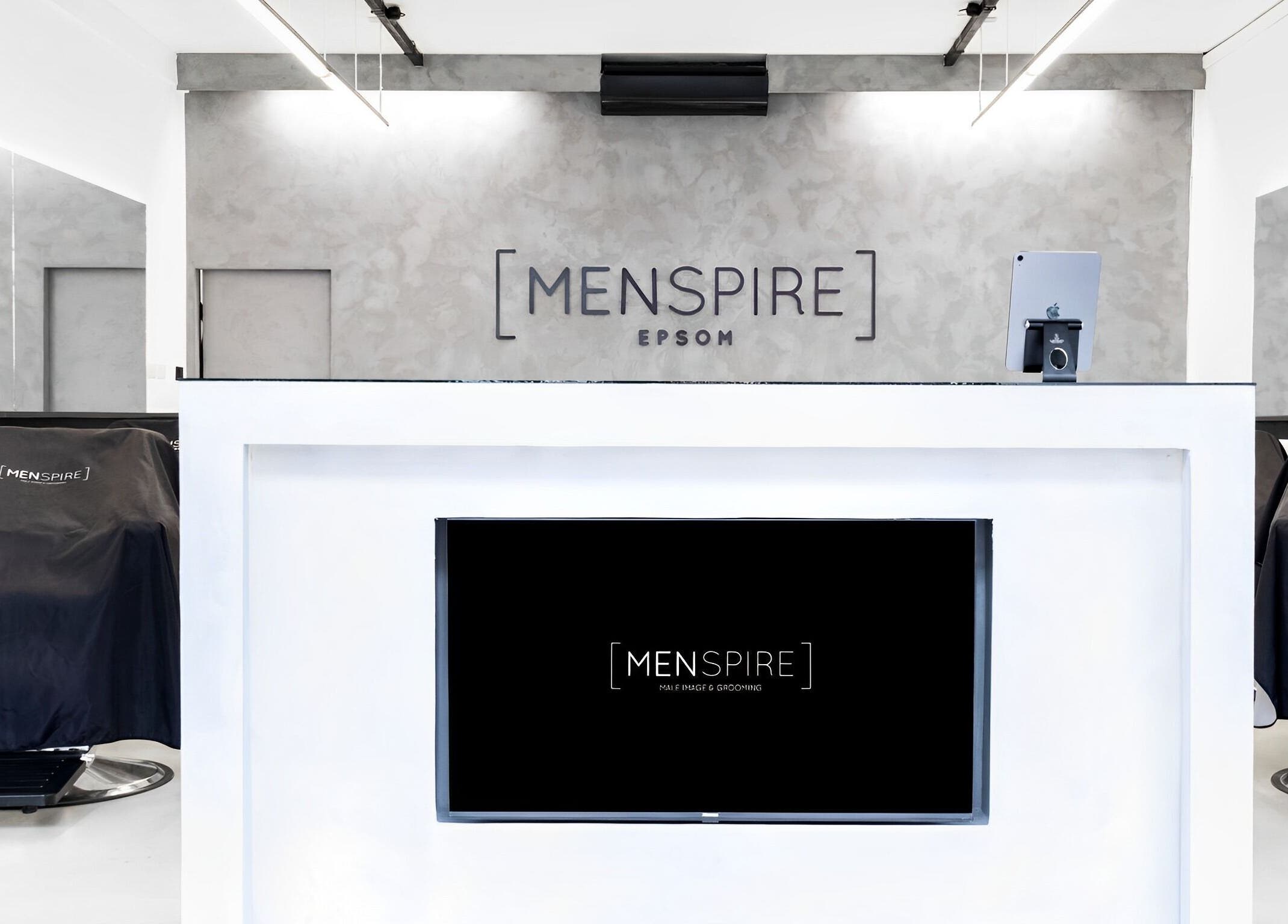 Sleek interior of Menspire Epsom, featuring contemporary design and logo in Epsom, England, GB.