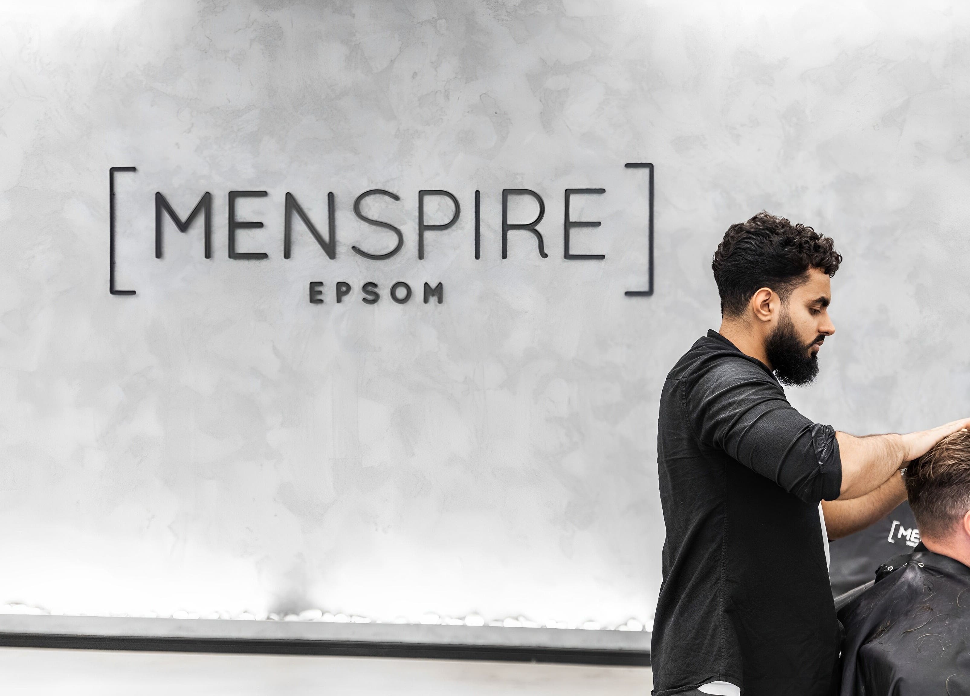 Stylist at Menspire Epsom in Epsom, England, GB providing a professional haircut service.