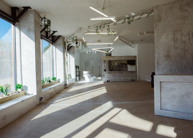 Spacious, modern interior of Menspire Academy in St Albans, England, GB with natural light and sleek decor.