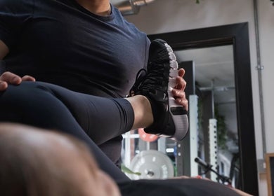 Physical therapist assisting a stretch at A Fitness - Health and Wellness Clinic, London, England, GB.
