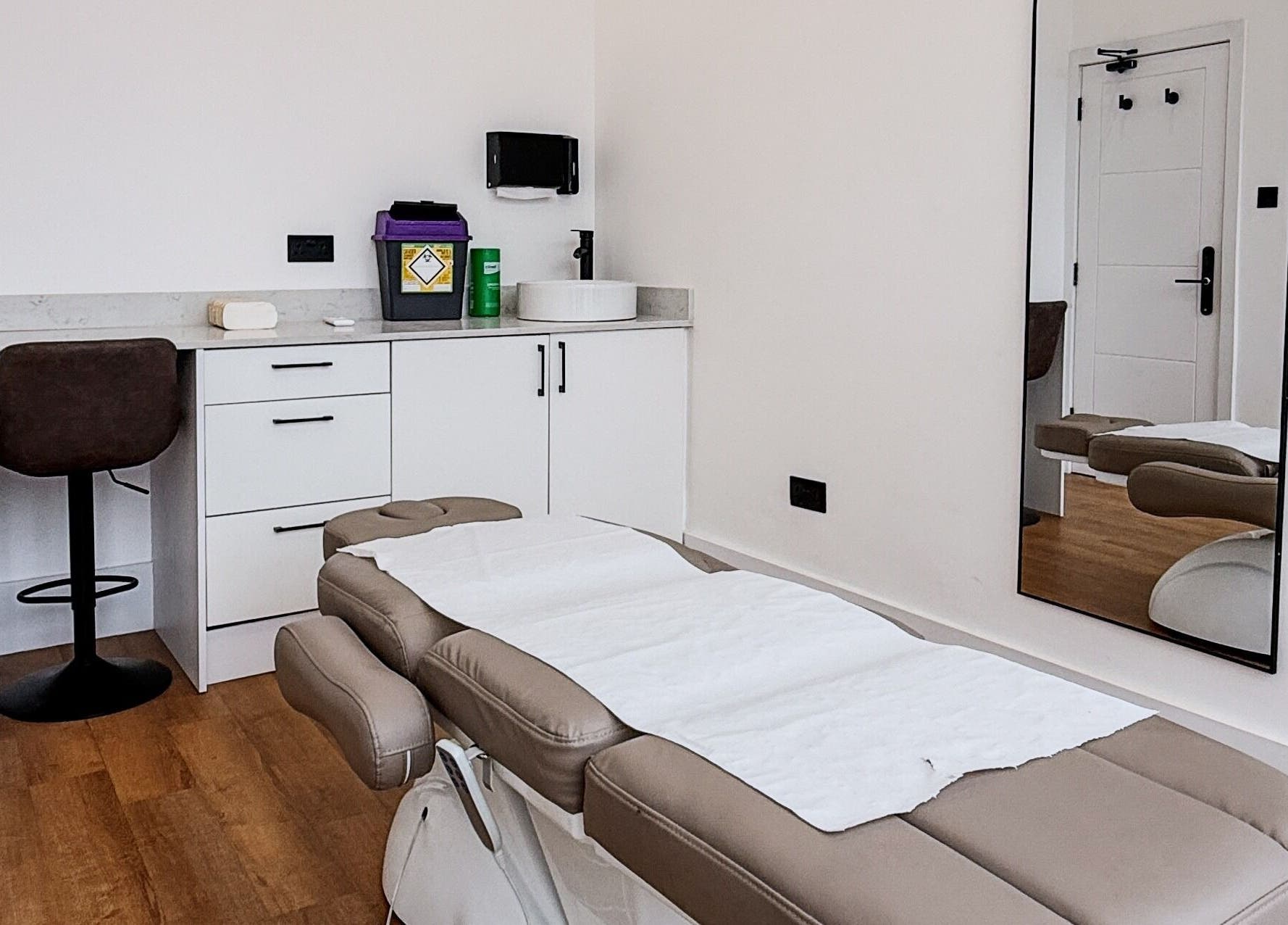 Sleek therapy room at A Fitness - Physical Therapy Clinic, London, England, GB, featuring a treatment bed.