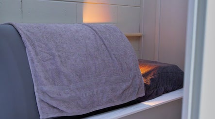 A relaxing treatment room with warm lighting at Solais, Stirling, Scotland, GB.