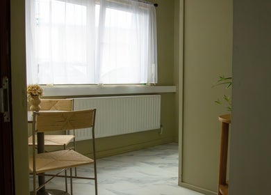 Bright and serene seating area at Solais, Stirling, Scotland, GB with natural light and elegant decor.