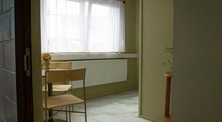 Bright and serene seating area at Solais, Stirling, Scotland, GB with natural light and elegant decor.