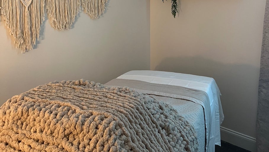 Tranquil therapy room at Radiance by Rylie, Boiling Springs, South Carolina, US, with soft blankets and wall decor.