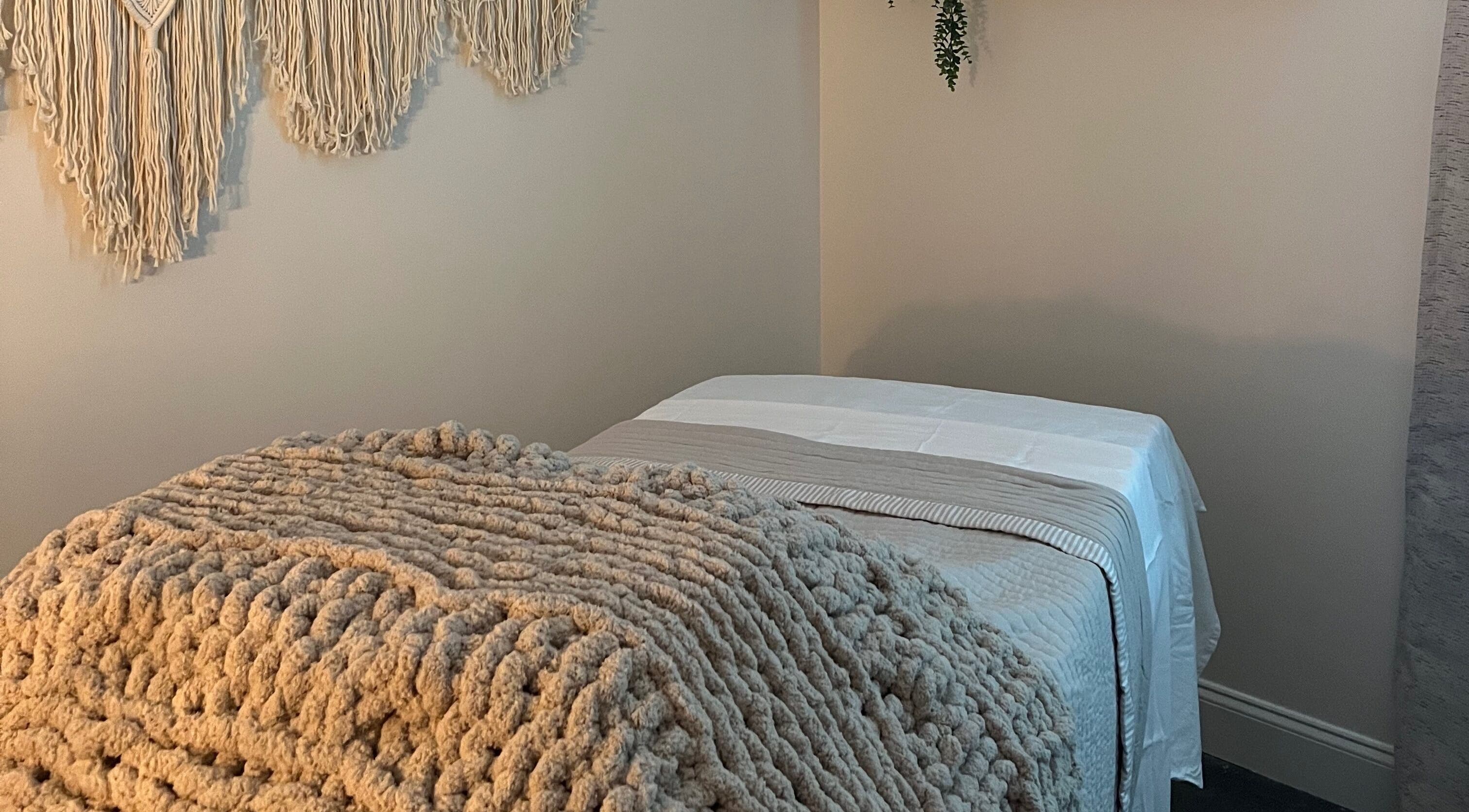 Tranquil therapy room at Radiance by Rylie, Boiling Springs, South Carolina, US, with soft blankets and wall decor.