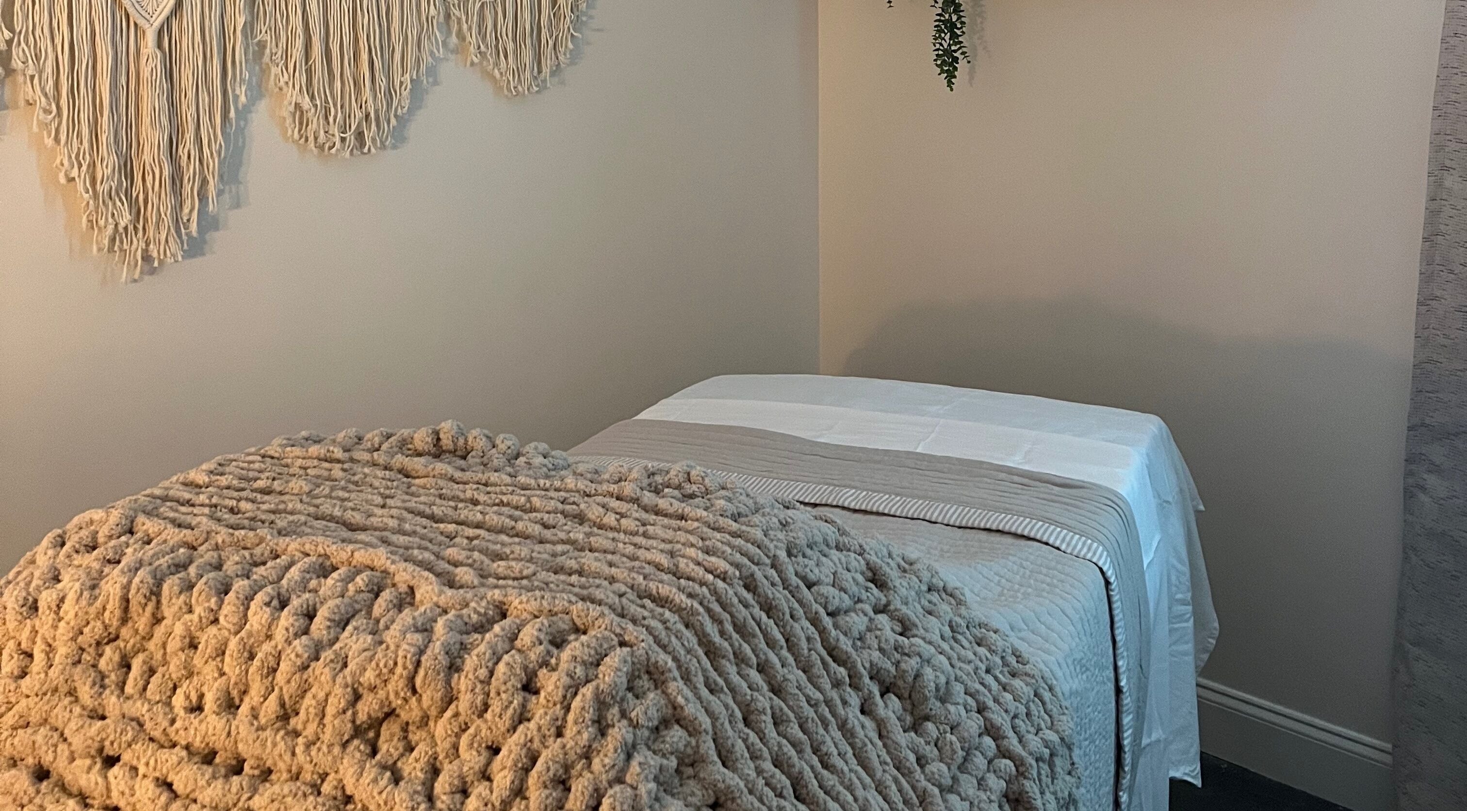 Tranquil therapy room at Radiance by Rylie, Boiling Springs, South Carolina, US, with soft blankets and wall decor.