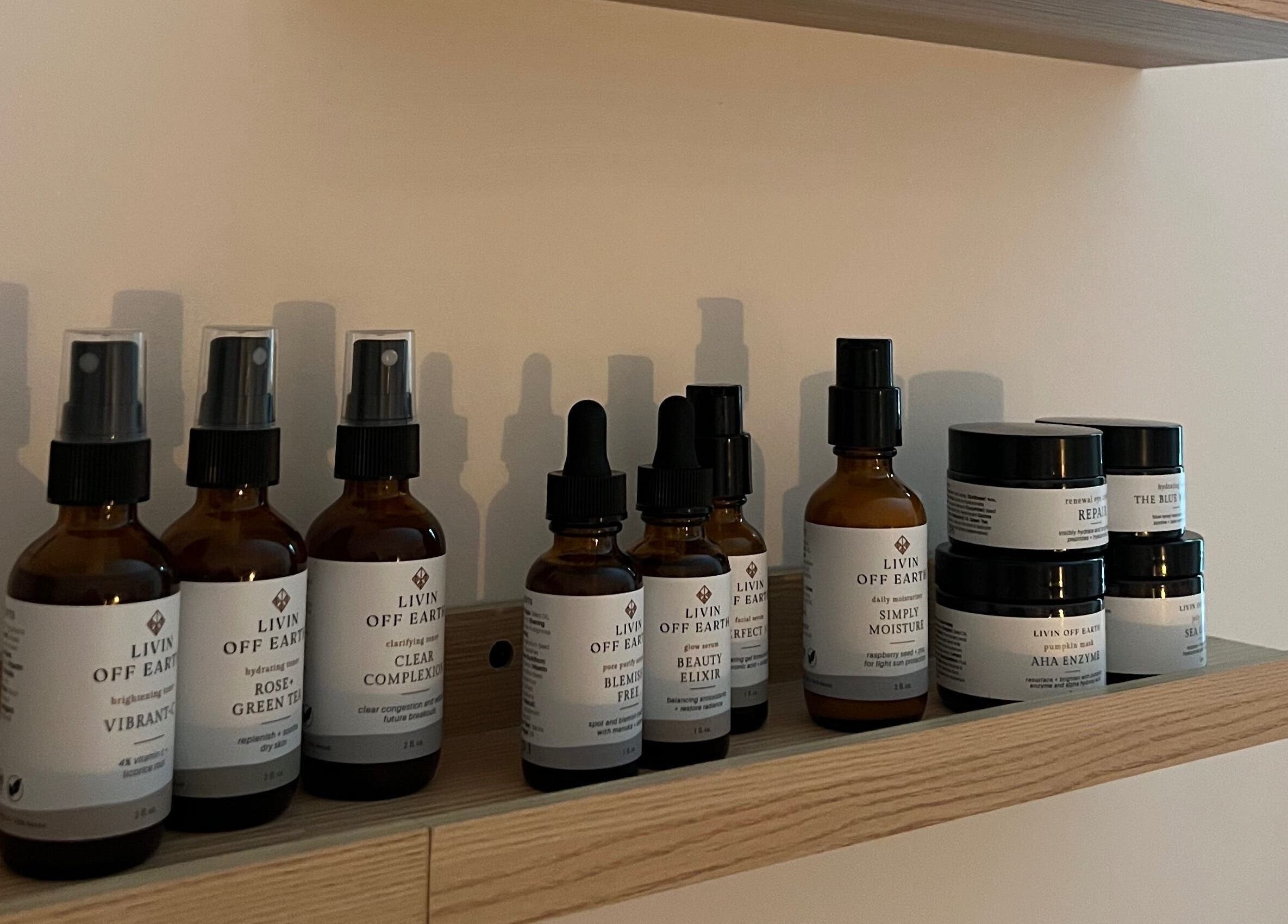 Organic skincare products on wooden shelf at Radiance by Rylie in Boiling Springs, South Carolina, US.