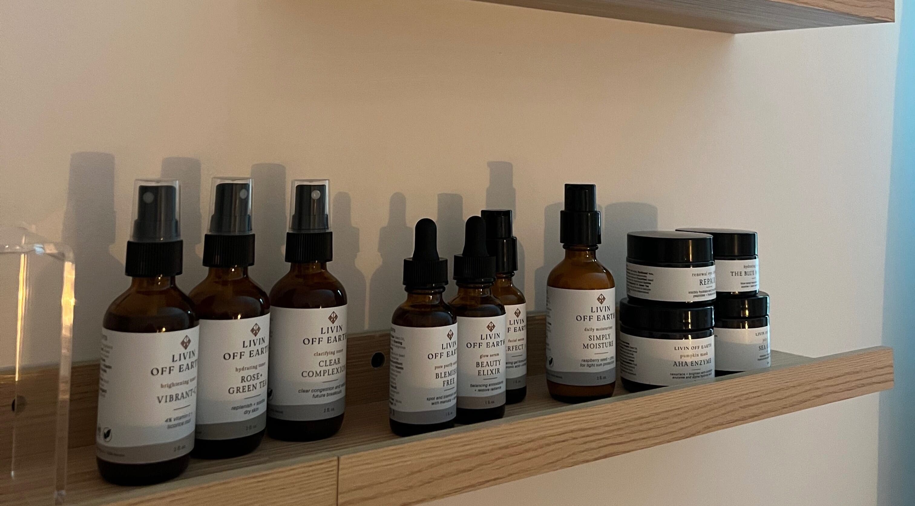 Organic skincare products on wooden shelf at Radiance by Rylie in Boiling Springs, South Carolina, US.